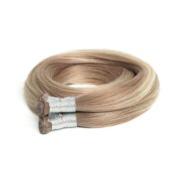 Two bundles of GENIUS WEFT Hair Extensions 7-Star Full Cuticle Remy Hair in brown and hazelnut colors